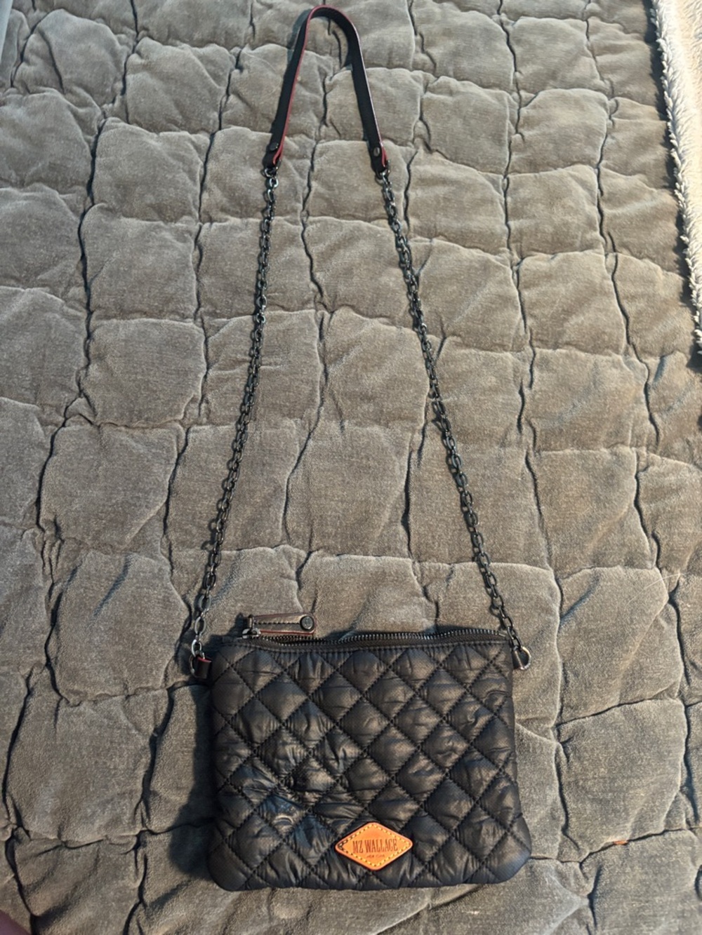 MZ Wallace Black Quilted Crossbody with Tan Leather Logo and black chain strap.